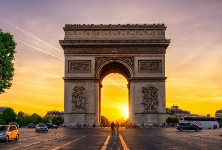 Paris The Arc de Triomphe (Arc de Triomphe) in Chaps Elysees at sunset, Paris, France. Architecture and monuments of Paris. Paris postcard