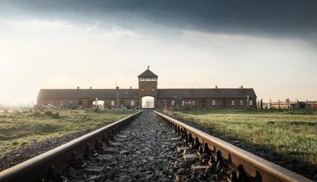 Railroad Track and the Gate of Death – Entrance of Auschwitz II – Birkenau, former German Nazi Concentration