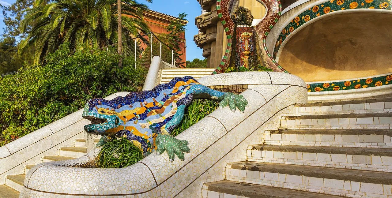 Stairway with sculpture Salamanders Mosaic lizard ceramic tile, decoration in Park Guell, Barcelona, Spain.