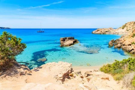 View of Cala Tarida bay with rocks in turquoise sea water, Ibiza island, Spain