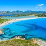 View of a beautiful bay with azure sea from top of a hill, Villasimius, Sardinia island, Italy