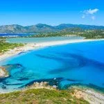 View of a beautiful bay with azure sea from top of a hill, Villasimius, Sardinia island, Italy