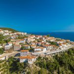Aerial photo of the coastal village and the beach of Dhermi Albania