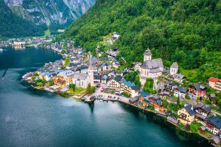 Aerial view of austrian mountain village Hallstatt and Hallstatter lake. Beautiful summer time. Salzkammergut, Austria. Hallstatt village over Hallstatter See, in Salzkammergut, Austria.