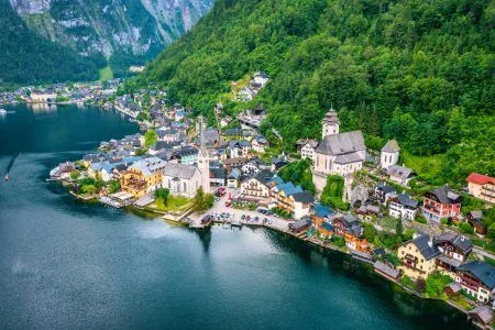 Aerial view of austrian mountain village Hallstatt and Hallstatter lake. Beautiful summer time. Salzkammergut, Austria. Hallstatt village over Hallstatter See, in Salzkammergut, Austria.
