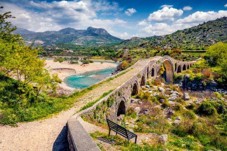 Amazing spring view of Old Mes Bridge. Stunning morning landscape of Shkoder. Picturesque outdoor scene of Albania, Europe. Traveling concept background.