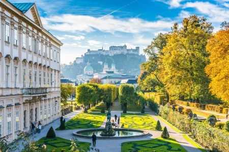 Beautiful view of the famous Mirabell Gardens with the historic Hohensalzburg Fortress in the background in Salzburg, Austria