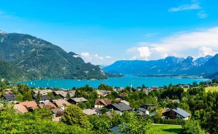 Beautiful view on Wolfgangsee lake by in St Sankt Gilgen (town where Mozart mother born) with alps mountains, blue sky, clouds. Salzkammergut, Salzburg, Austria