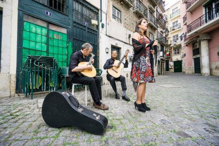 Fado band performing traditional portuguese music on the square of Alfama, Lisbon, Portugal