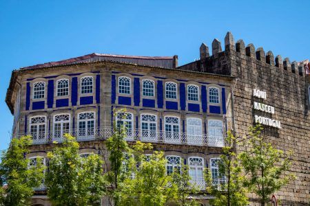 Guimarães city center wall it is written Aqui nasceu Portugal (Portugal was born here).