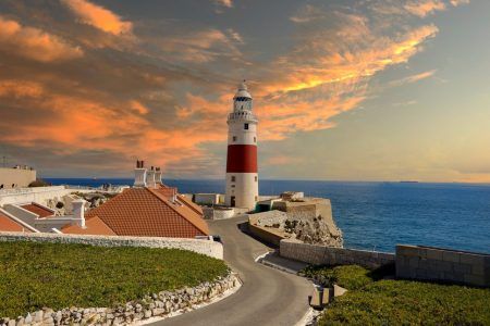 Lighthouse of Europa Point at sunset in Gibraltar. Europa Point is the southernmost point of Gibraltar.