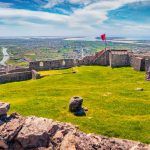 Magnificent spring view of ruins of Lezhe Fortress. Spectacular morning cityscape of Lezha town, Albania, Europe. Traveling concept background.