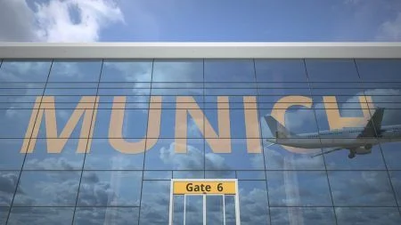 Munich city name and landing plane at modern airport 3D rendering