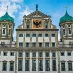 New Detail of the upper facade of the Augsburg City Hall and the shield of the city. Photography taken in Augsburg, Bavaria Germany.