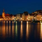 Night view on the Sonderborg. Harbour. the lights of the evening city reflected in the water. Southern Denmark.