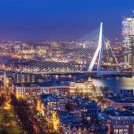 Panorama of Rotterdam with the Erasmus Bridge at dusk seen from the Euromast tower in the Netherlands