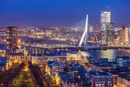 Panorama of Rotterdam with the Erasmus Bridge at dusk seen from the Euromast tower in the Netherlands