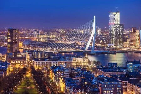 Panorama of Rotterdam with the Erasmus Bridge at dusk seen from the Euromast tower in the Netherlands