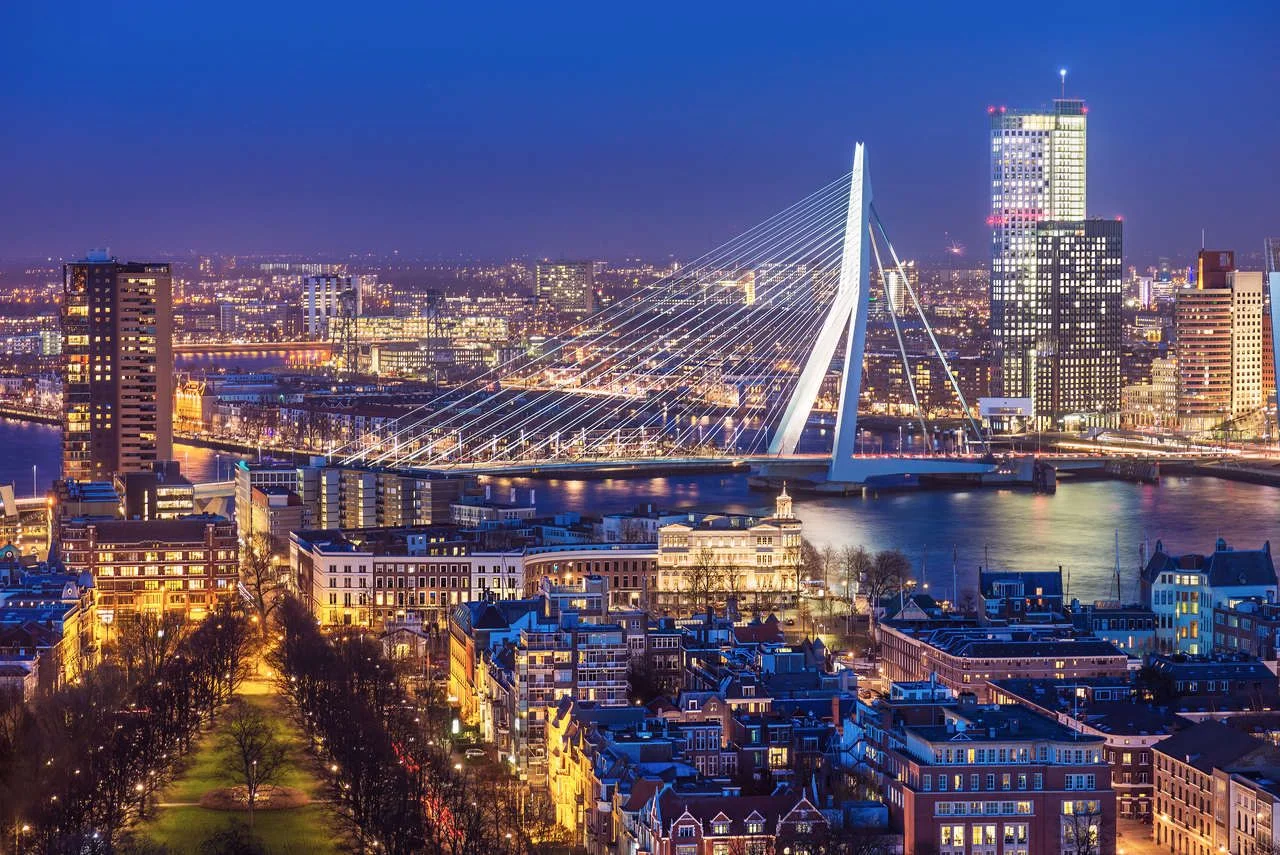 Panorama of Rotterdam with the Erasmus Bridge at dusk seen from the Euromast tower in the Netherlands