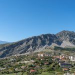 Photo of the village of Leskovik , Korce Albania. this village is positioned next to a mountain with lots of cliffs