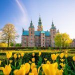 Rosenborg Castle Gardens in Copenhagen, Denmark with blue sky