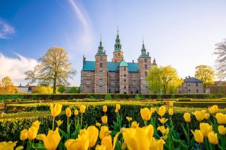 Rosenborg Castle Gardens in Copenhagen, Denmark with blue sky