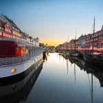 Ships in Nyhavn at sunset, Copenhagen, Denmark