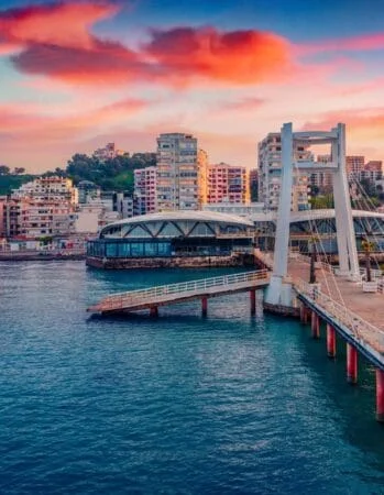 Spectacular sunrise in Durres, port city on the Adriatic Sea in western Albania, Europe. Impressive Adriatic seascape. Exotic spring scene of Albania. Traveling concept background.