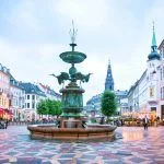 Stork Fountain on the Amagertorv (Amager Square) and the longest pedestrian street in the world Stroget in Copenhagen Copenhagen, Denmark.