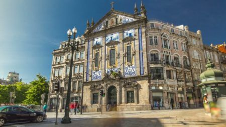 View of the Almeida Garret Square near the Sao Bento railway station with Congregados Church at the front, Porto, Portugal.