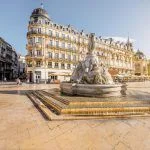 A view of Comedy Square with the Three Graces Fountain during the morning light in the city of Montpellier, southern France