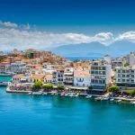 Agios Nikolaos, Crete, Greece. Agios Nikolaos is a picturesque town in the eastern part of the island of Crete built on the northwest side of the peaceful Mirabello Bay.