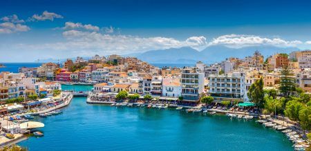 Agios Nikolaos, Crete, Greece. Agios Nikolaos is a picturesque town in the eastern part of the island of Crete built on the northwest side of the peaceful Mirabello Bay.