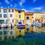 Colorful houses reflecting in canal, Martigues Old Town, Provence, France