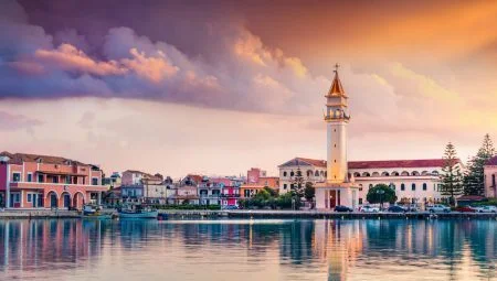 Impressive spring sunset in Zakynthos Town. Dramatic evening view of the City Hall and Saint Dioniysios Church, Ionian Sea, Zakynthos Island, Greece, Europe. Travel concept background.