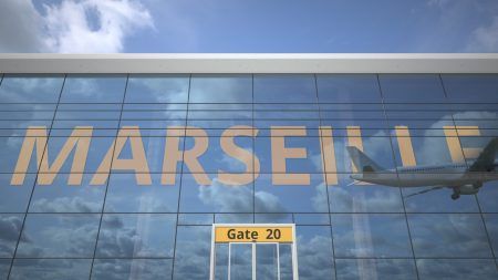 Marseille city name and landing airplane at airport terminal 3D rendering