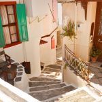 Narrow street, stairs and doors in Vathi, Samos, Greece