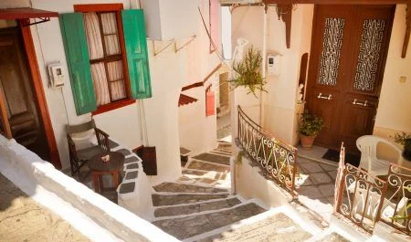 Narrow street, stairs and doors in Vathi, Samos, Greece