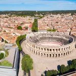 Nimes Arena aerial panoramic view. Nimes is a city in the Occitanie region of southern France