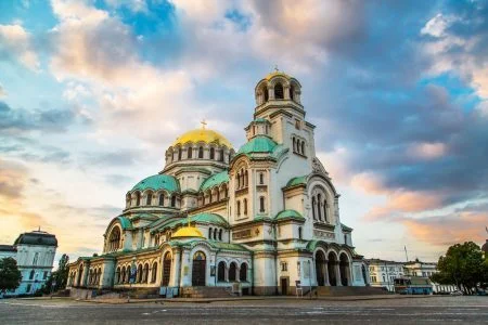 St. Alexander Nevsky in the center of Sofia, Bulgaria’s capital against a blue morning sky with colorful clouds