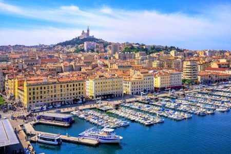 The old Port of Vieux and the Basilica of Notre Dame de la Garde in the historic center of Marseille, France