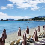 Umbrellas and sundecks on Laganas beach in Zakynthos island, Greece