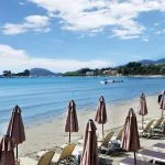 Umbrellas and sundecks on Laganas beach in Zakynthos island, Greece