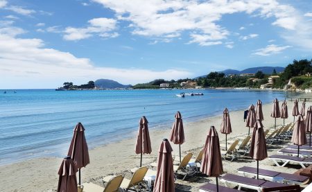 Umbrellas and sundecks on Laganas beach in Zakynthos island, Greece