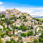 View of Gordes, a small medieval town in Provence, France. A view of the ledges of the roof of this beautiful village and landscape.