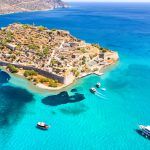 View of the island of Spinalonga with calm sea. Here were isolated lepers, humans with the Hansen’s desease, gulf of Elounda, Crete, Greece.