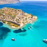 View of the island of Spinalonga with calm sea. Here were isolated lepers, humans with the Hansen’s desease, gulf of Elounda, Crete, Greece.