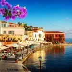 the bay of Chania on a sunny summer day, Crete Greece with flowers