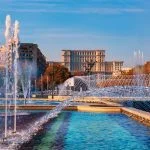Famous building of Parliament house in Bucharest, the bigest landmark of Romania near the new fountains of capital.