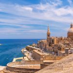 Top view of the golden domes of churches and roofs from the Church of Our Lady of Mount Carmel and St. Paul’s Anglican Pro-Cathedral, Valletta, the capital of Malta